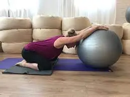 Child’s Pose with an exercise ball